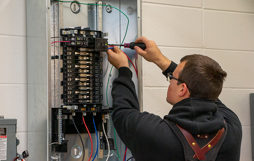 An Electrical Construction student working in class