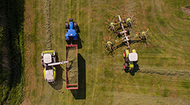 Farm equipment in a field from an aerial viewpoint