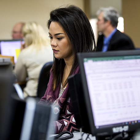 A student studying at a computer