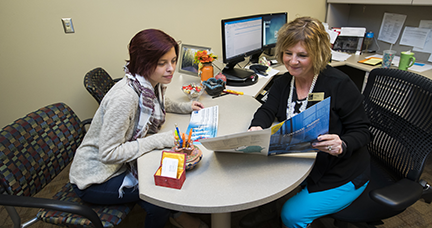 An admissions advisor assisting a student