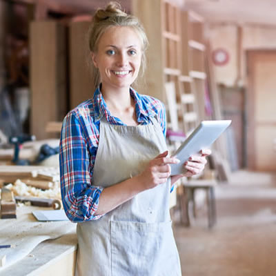 Woman using a tablet in her place of business