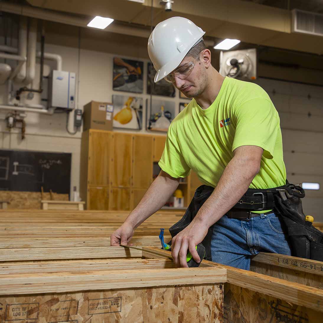 A construction student doing hands-on work