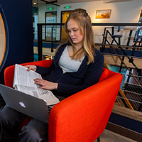 Student working on homework in the cafe