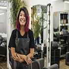 Hairdresser smiling in her salon