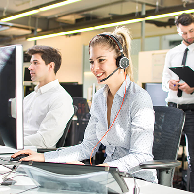 A customer service representative working in a call center