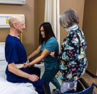 Nursing Assistant student practicing correct lifting technique