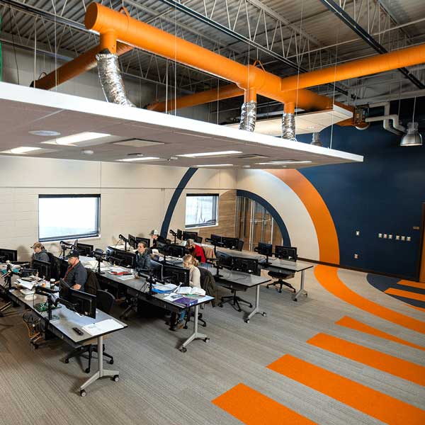 Classroom space with students working at computers