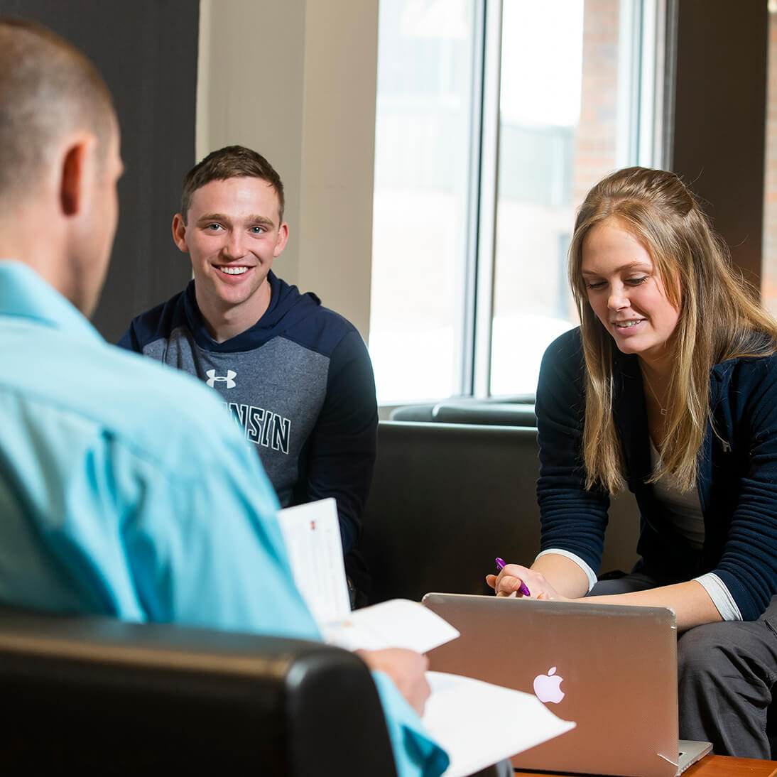 Students sitting in a common area on campus