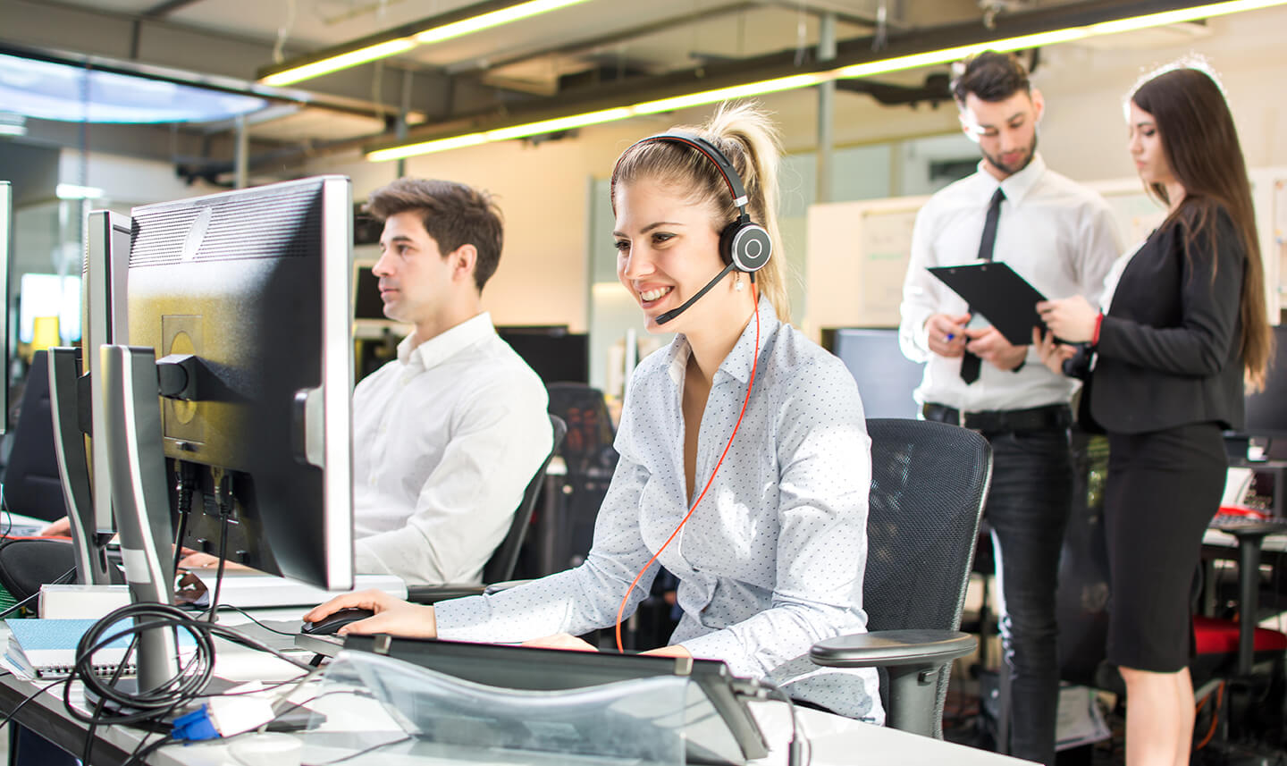 A customer service representative working in a call center