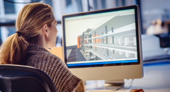 A designer using building software at work