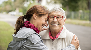 Mom and Daughter hugging and smiling