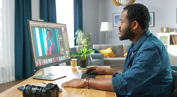 A photographer using a photo editing software