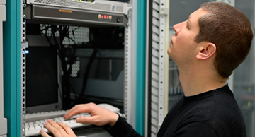 A systems administrator performing preventative maintenance