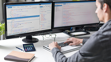 An IT professional working at his computer