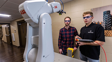 Students working with a robot