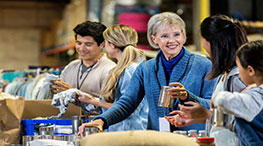 Senior woman volunteering at a food bank.