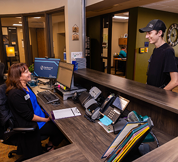 Student Service employee helping a student