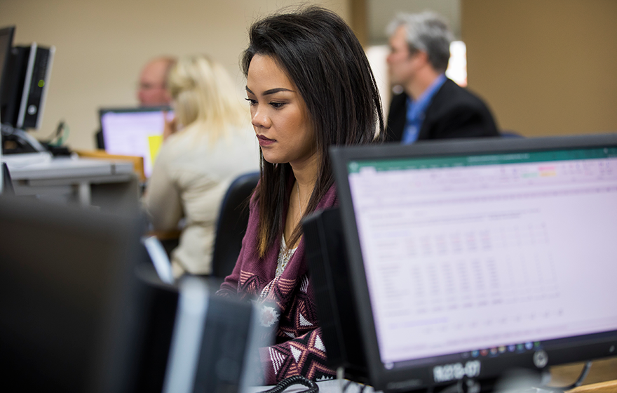 A student sitting at a computer