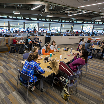 Group of students hanging out in the Hub