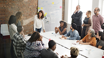 A group of professionals in a team meeting