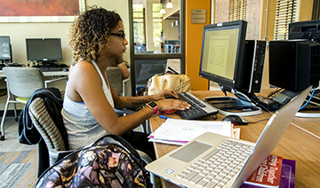 Student studying at a computer