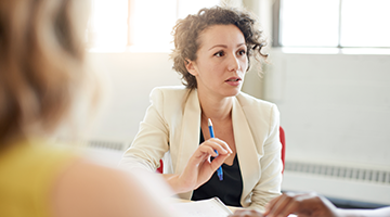 A business professional in a group meeting