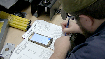 A student making mechanical calculations