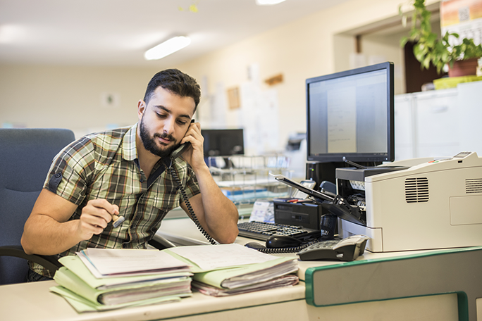 An office worker making a phone call