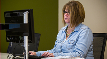 A student sitting at a computer