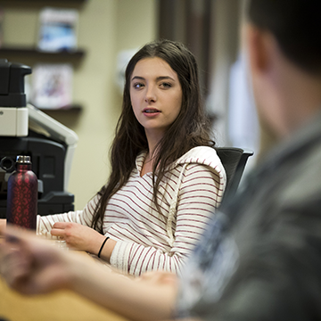 Student having a conversation with another student