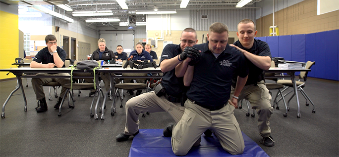 Criminal Justice Academy students going through a simulation