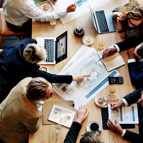 A group of business professionals working in a group together