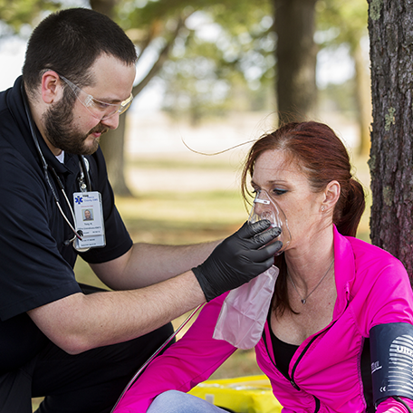An EMT-Paramedic student practicing skills on a person