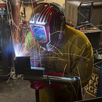 A student practicing welding skills