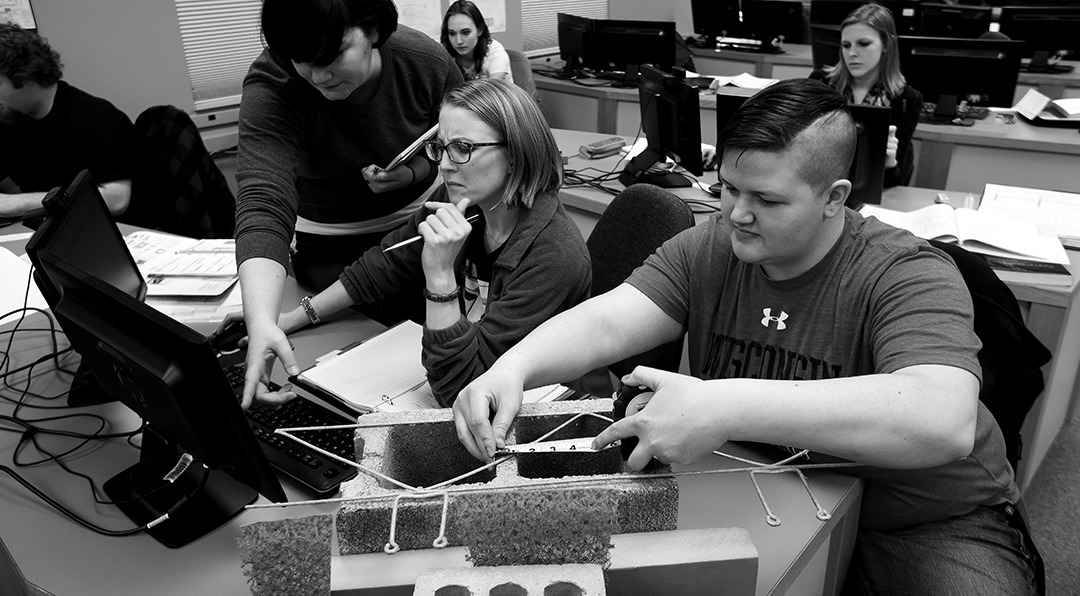 Students working with construction materials