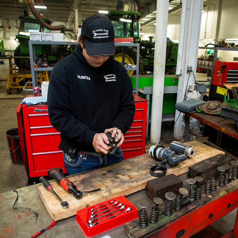 A student doing hands-on work in the shop