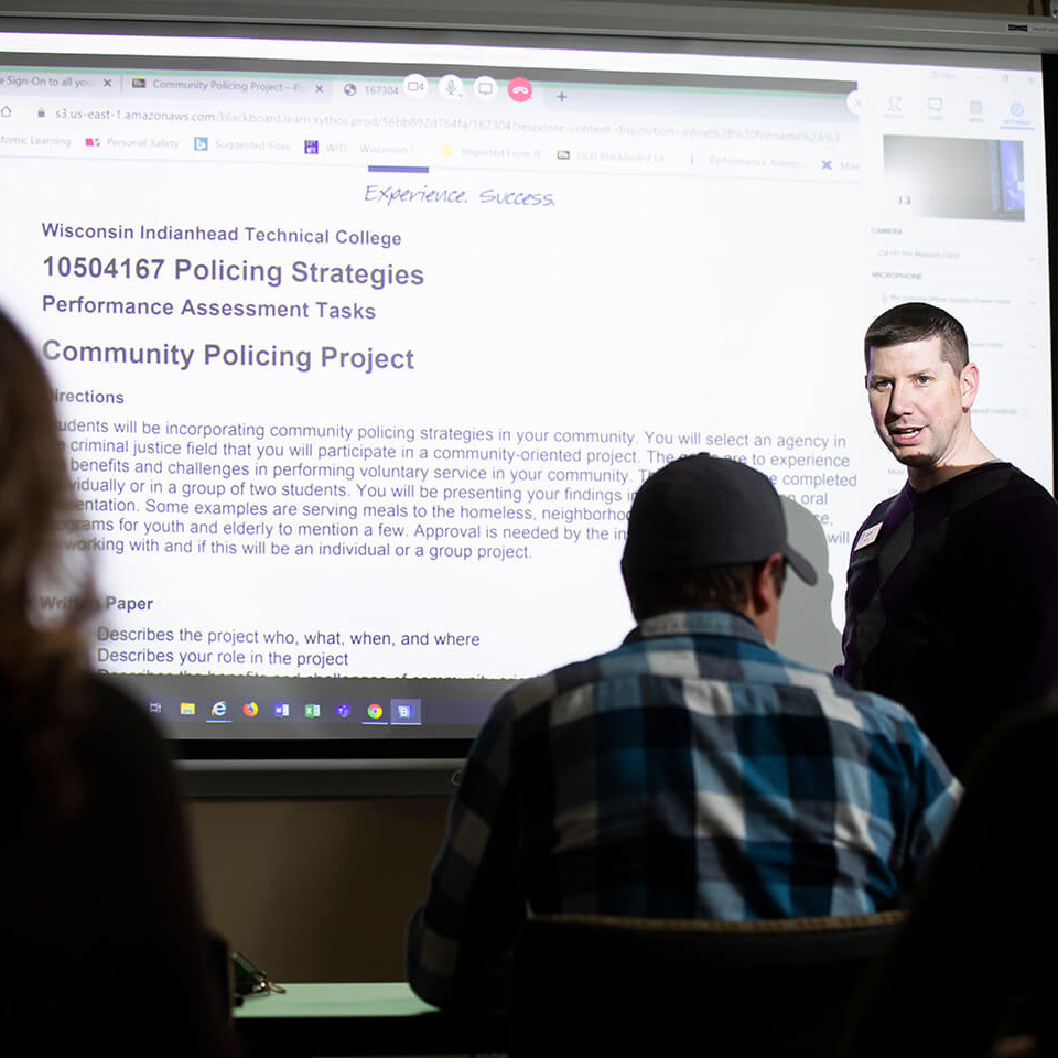 Criminal justice instructor presenting to the classroom