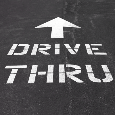 Drive Thru spray-painted on the road