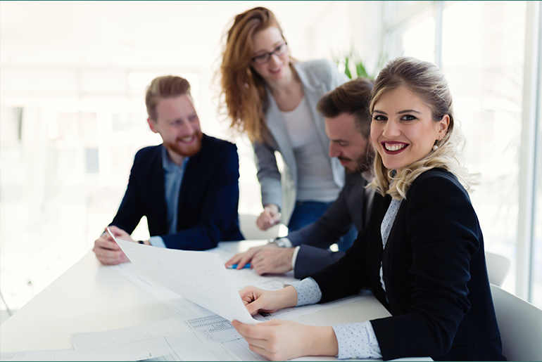 Group of diverse individuals meeting in a conference room