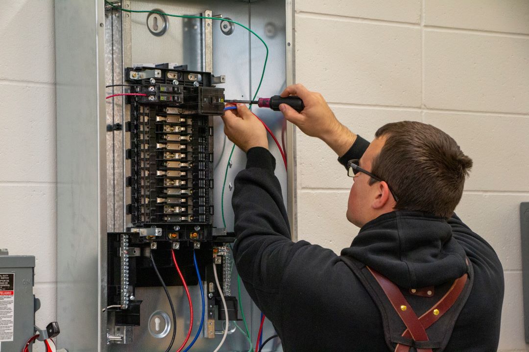 student working on wires