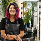 Hairdresser smiling in her salon