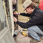 A student doing hands-on work in the HVAC industry