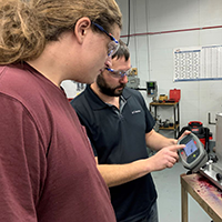 Student getting instructions from IMT instructor