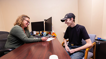 An admissions advisor assisting a student