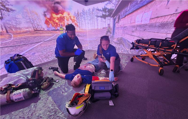 EMT students practicing a real-world scenario in the simulation class