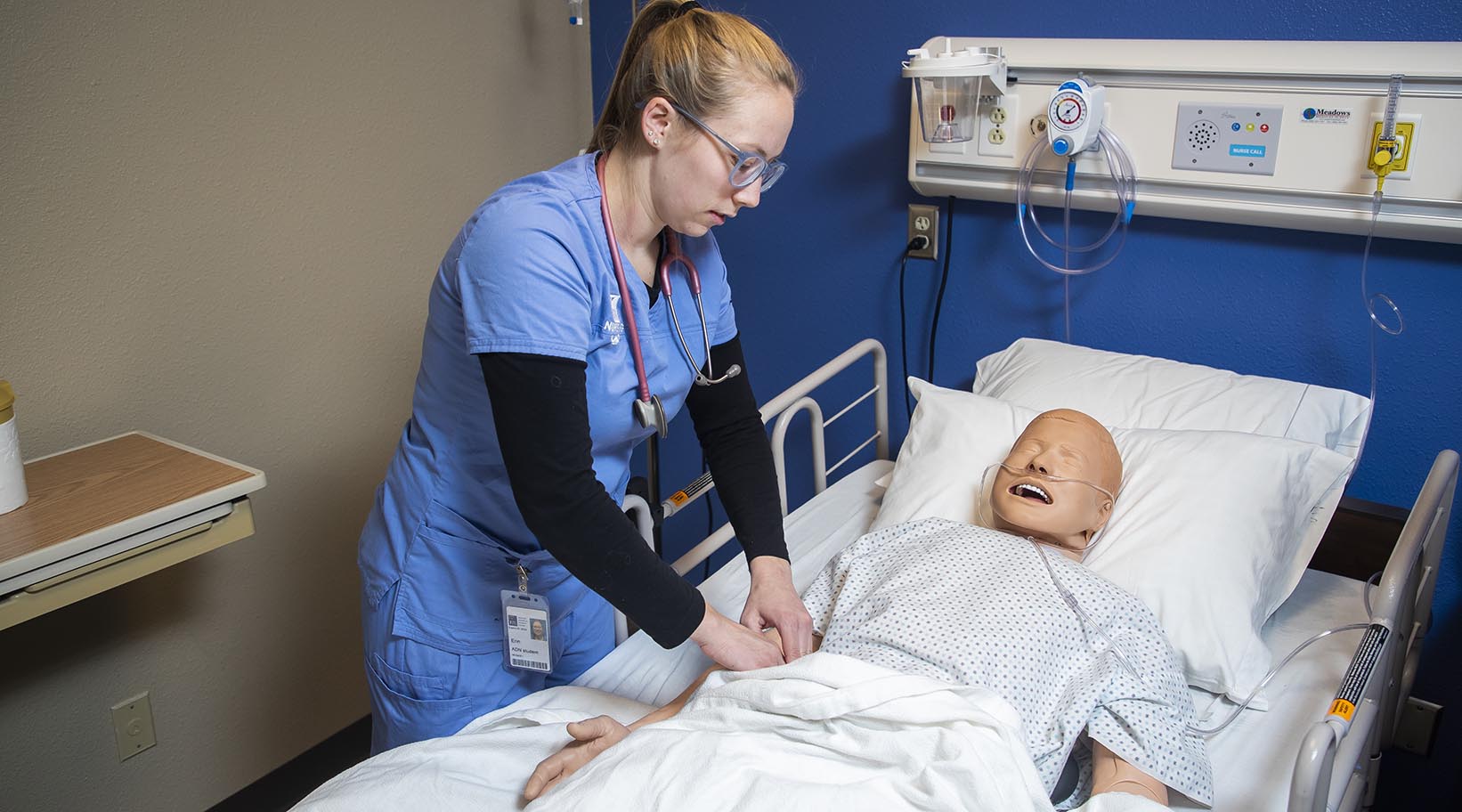 A student nurse working on a simulated patient