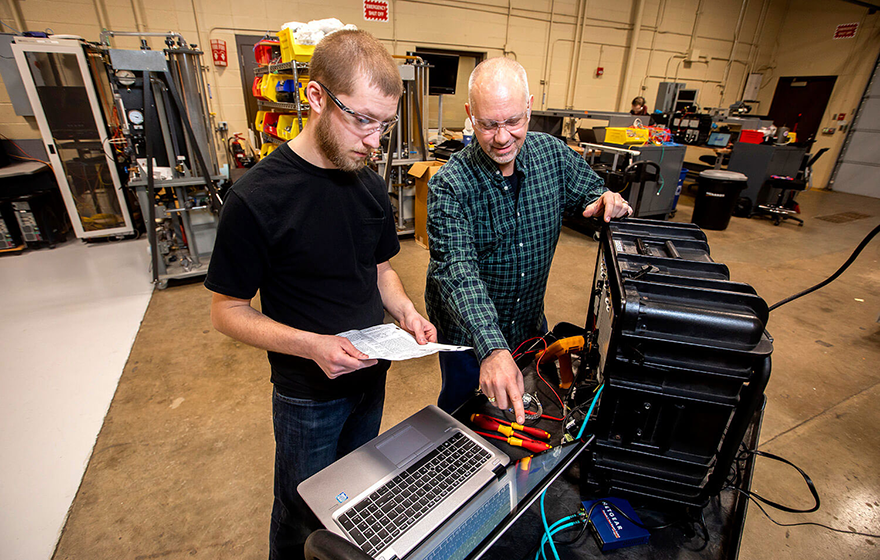 Student doing hands-on work in the automation lab