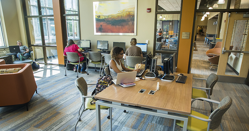 Students working in the Learning Commons Students working on laptops and desktops and studying in the modern Learning Commons space in New Richmond