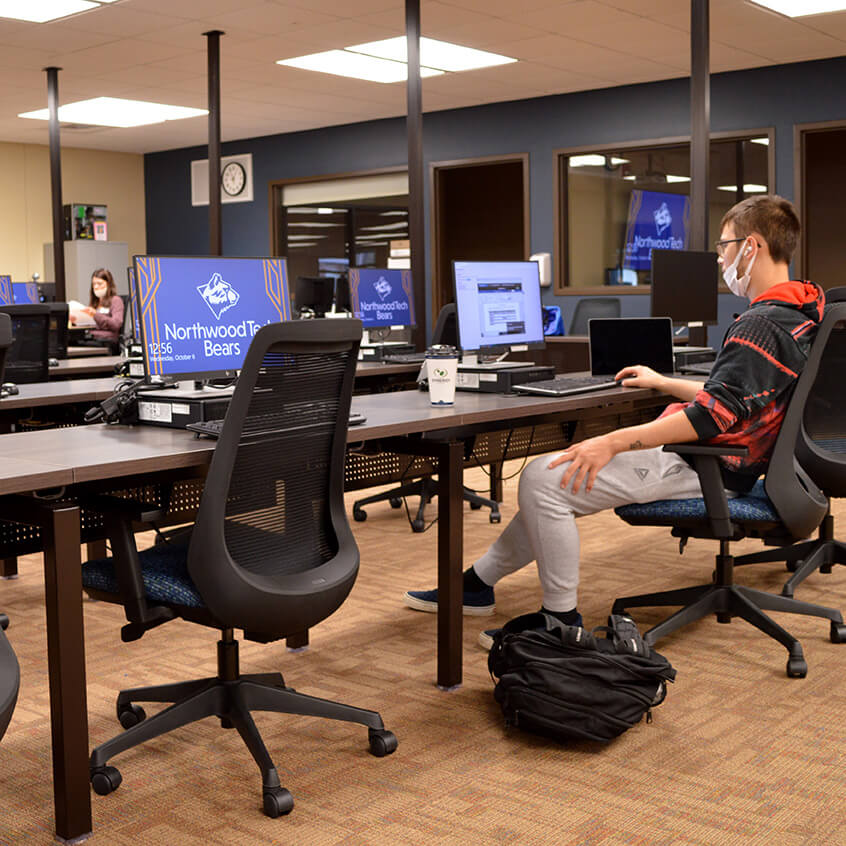 A student working on homework in the Learning Technology Center