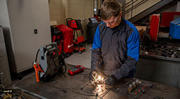 Student doing hands-on work in the automotive lab